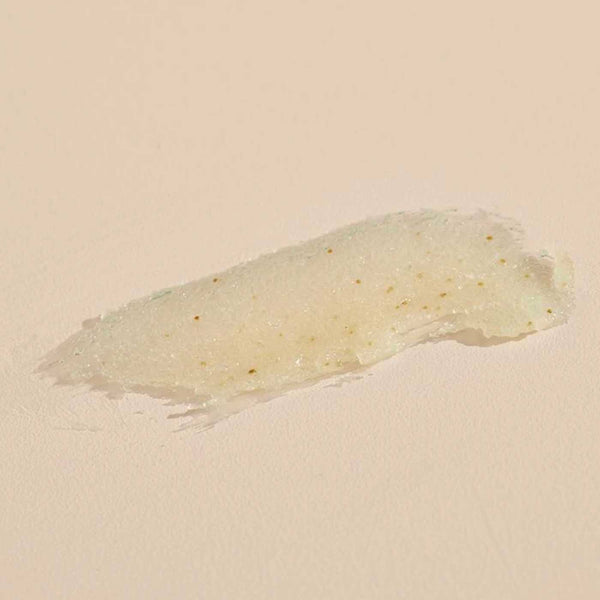 Close-up texture of a gentle body polish with natural exfoliating particles, highlighting Jasmine Tuberose BODY POLISH | Sparitual for skincare and body care wellness.