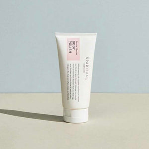 Tube of Jasmine Tuberose BODY POLISH | Sparitual skincare product standing on a flat surface with a soft neutral background, highlighting body care and wellness.