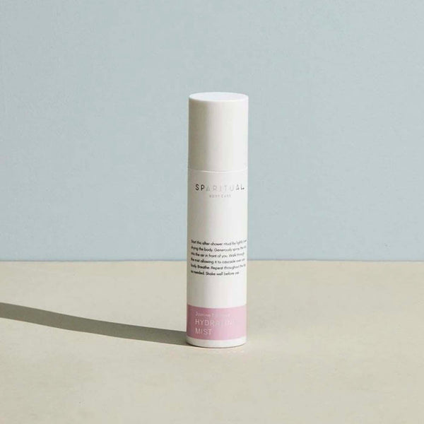 A sleek bottle of Jasmine Tuberose HYDRATING MIST | Sparitual, a skincare mist designed for hydrating and refreshing the skin, set against a minimal neutral background.