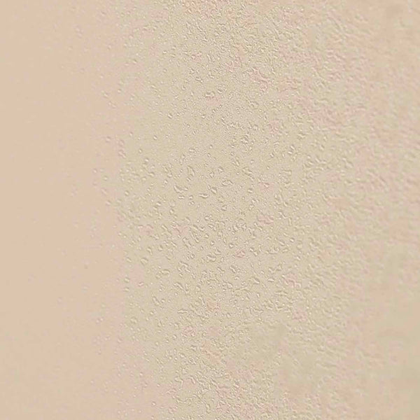 Close-up of a smooth beige surface with fine water droplets, illustrating hydration inspired by Jasmine Tuberose HYDRATING MIST | Sparitual skincare.