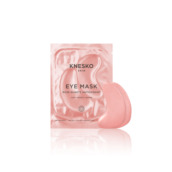 Rose quartz eye mask with antioxidant properties displayed next to its shiny pink packaging from the Rose Quartz Antioxidant Discovery Kit | Knesko, designed for skincare and soothing eye recovery.