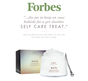 Jar of Moon Dip Back To Youth Ageless Body Mousse | Farmhouse Fresh with a small silver spatula beside it, endorsed as a bedtime self care treat in Forbes skincare feature.