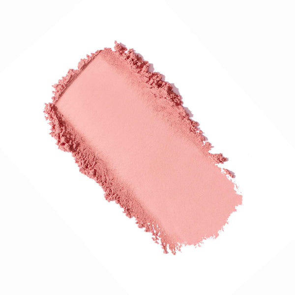 Soft pink powder swatch of Purepressed Blush | Jane Iredale showcasing a smooth, finely milled texture ideal for a natural, radiant makeup look.