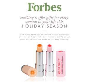 Forbes magazine feature highlighting Orange Mood Fruit™ Lip Therapy | Farmhouse Fresh, showing two lip balms with orange and strawberry flavors, designed for nourishing and tinting lips naturally.