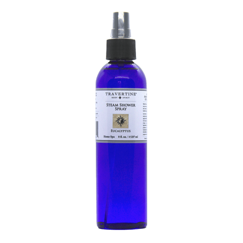 Blue spray bottle of Eucalyptus Steam Shower Spray | Travertine Spa with white label and black spray nozzle for skincare and wellness use.