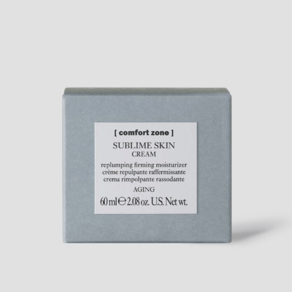 Grey box packaging of Sublime Skin Cream | [ comfort zone ], an aging skincare product described as a replumping firming moisturizer with a net weight of 60 ml or 2.08 ounces.